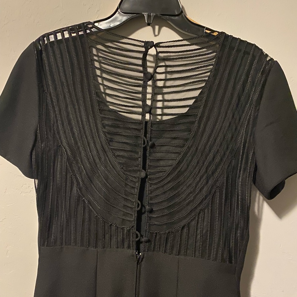Clifford and Willis. Black long elegant dress with the sheer back.